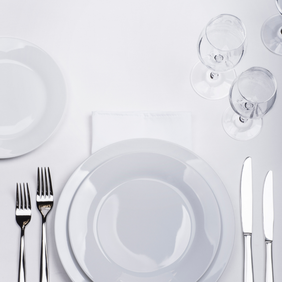 restaurant table setting with wine glasses