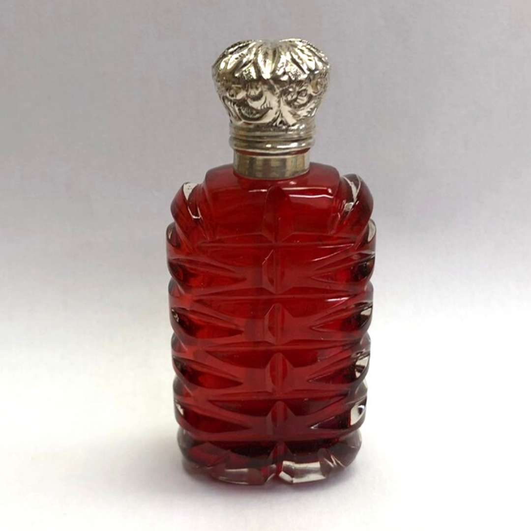 Cranberry perfume bottle with silver lid